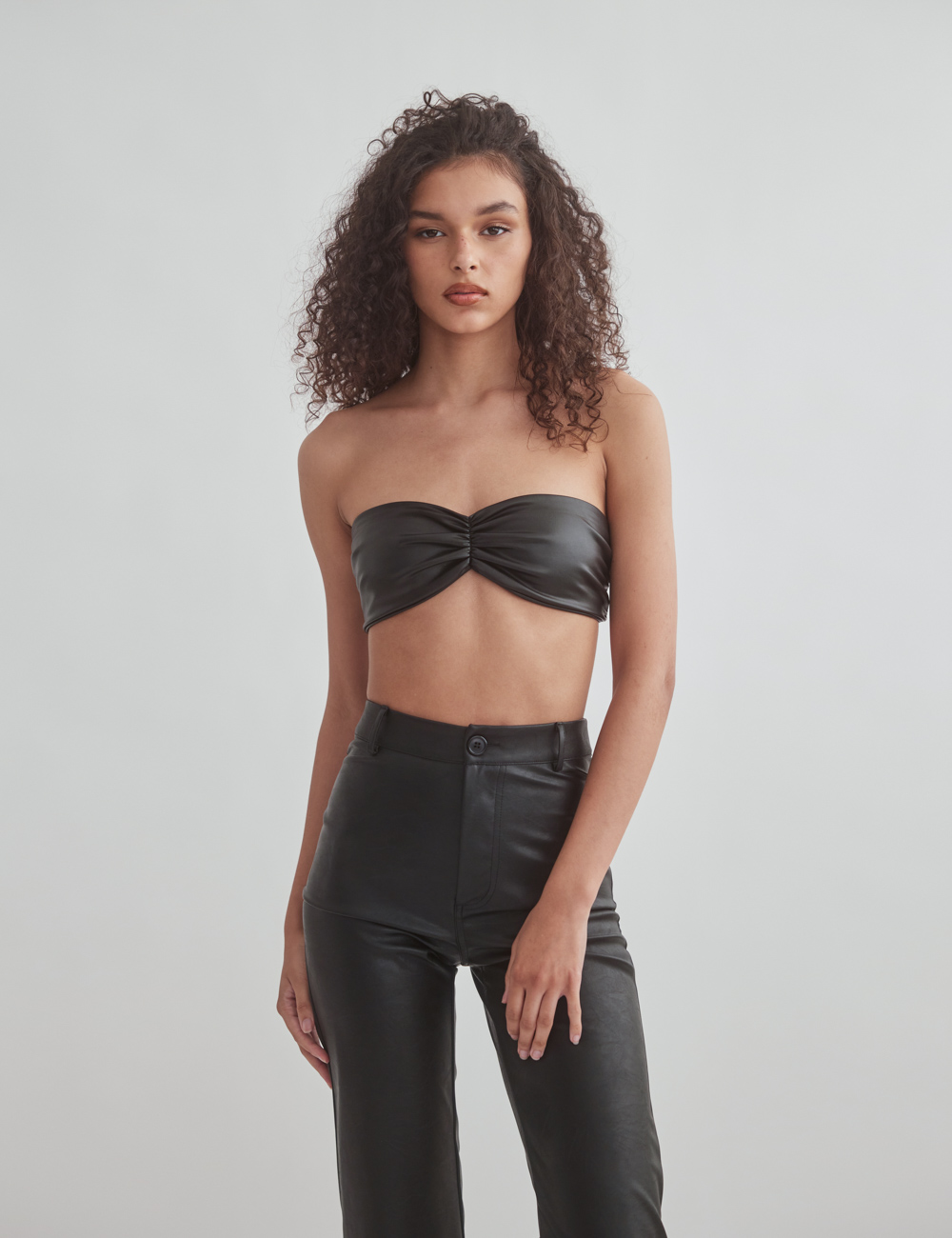 Woman faux leather ruched strapless crop top
