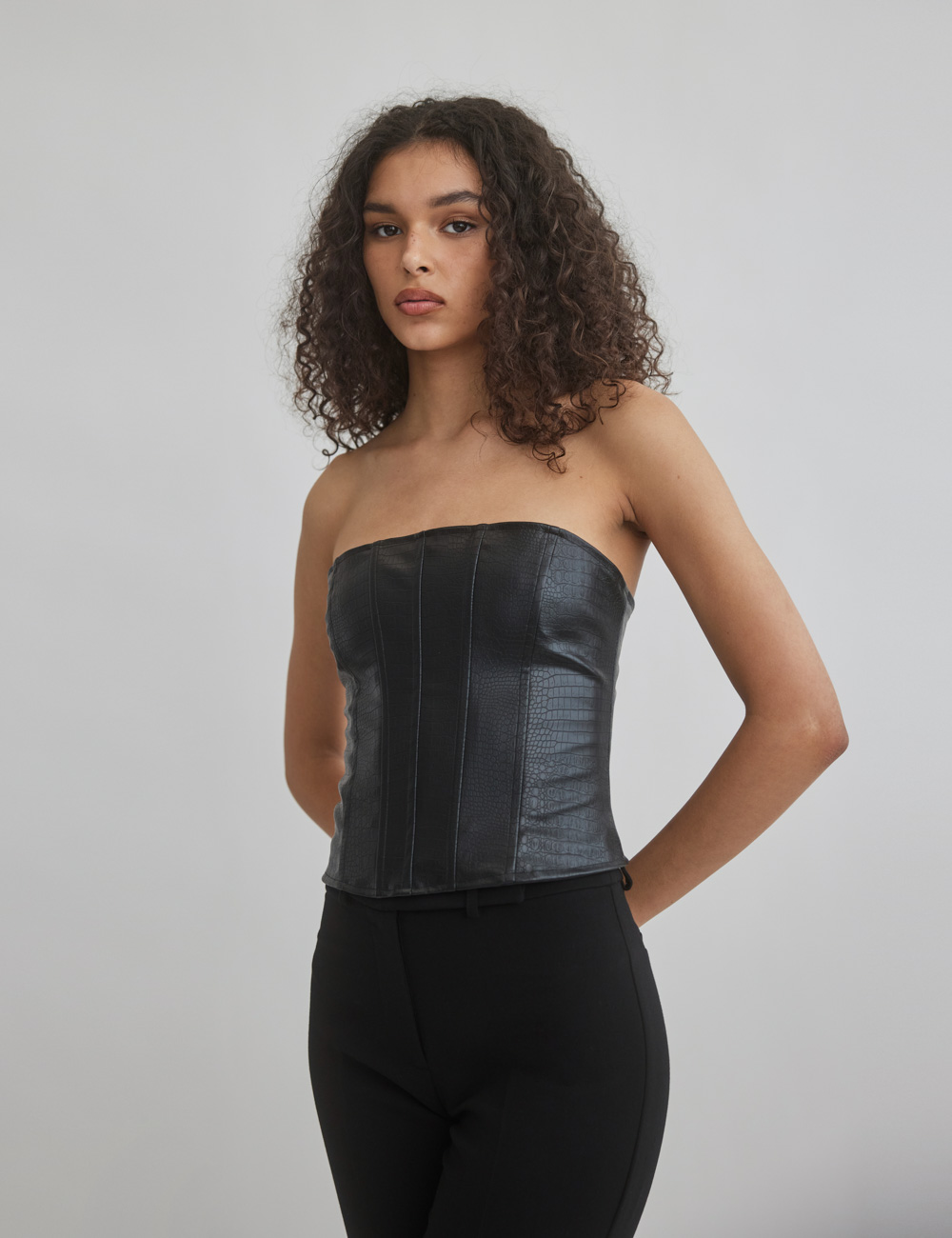 Woman textured faux leather corset top
